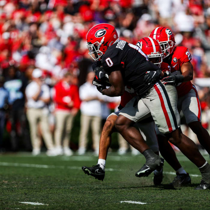 Georgia freshman RB Roderick Robinson (0) carries tacklers on a run during Georgia's spring game in April 2023.